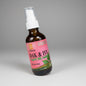 Bottle of Oak & Ivy product on a wooden surface with a blue background