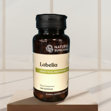 Nature's Sunshine Lobelia supplement bottle on a wooden surface with a blurred blue background
